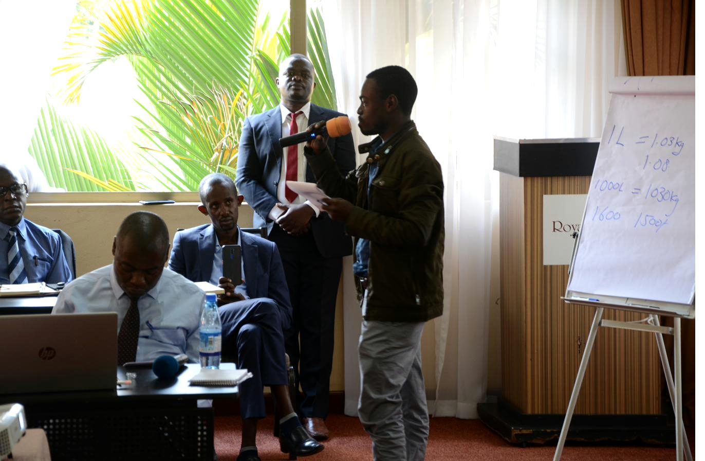 A presenter sharing study findings with stakeholders at a dissemination session