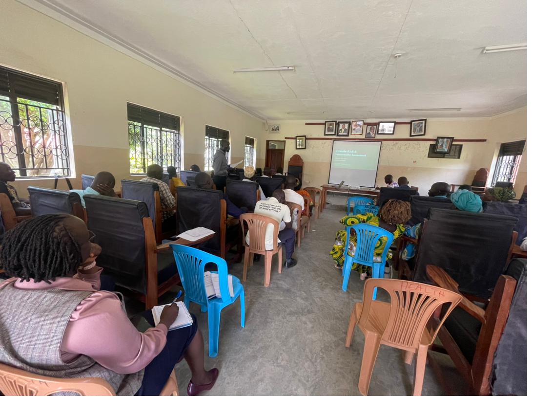 District stakeholders seated in a hall during the dissemination of climate risk assessment findings in Koboko